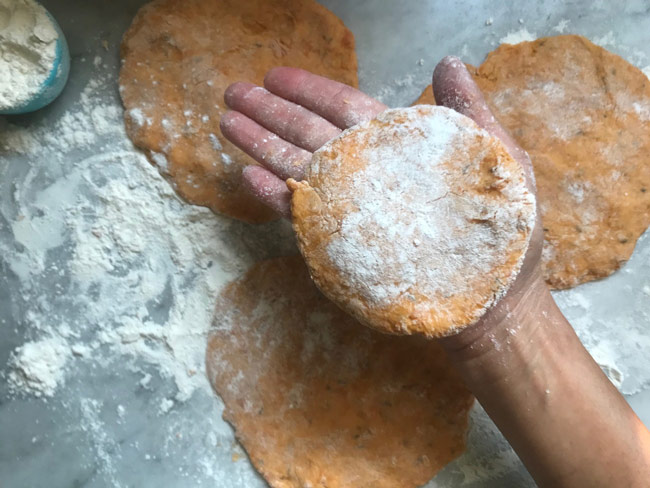 Flattened dough discs dusted with flour